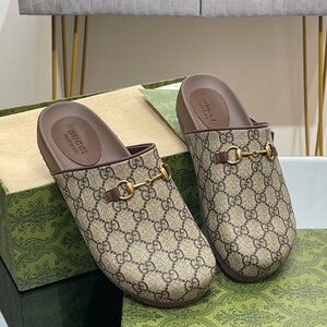 Gucci mule slippers in GG Supreme canvas